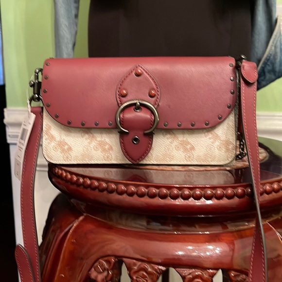 Handbags - Brand new coach crossbody nice Christmas gift. Leather material nicely made.